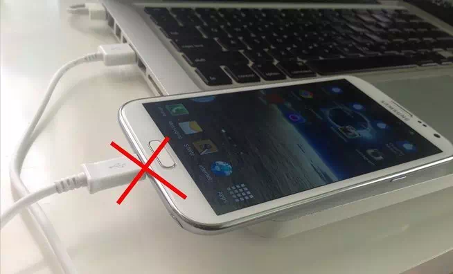 Never charge your phone from PC or Laptop لا تقم أبدًا بشحن هاتفك من جهاز الكمبيوتر أو الكمبيوتر المحمول